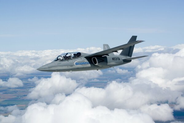 The Scorpion Isr attack aircraft flies in the sky against the background of clouds