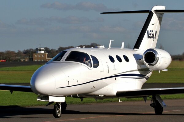 Twin-engine white aircraft on the runway