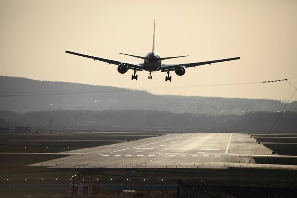 The plane is landing. Beautiful photo of the plane. An airport