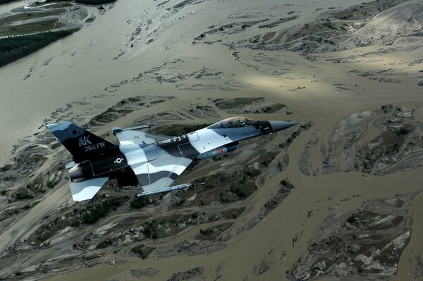 Multipurpose fighter fighting falcon over the landscape