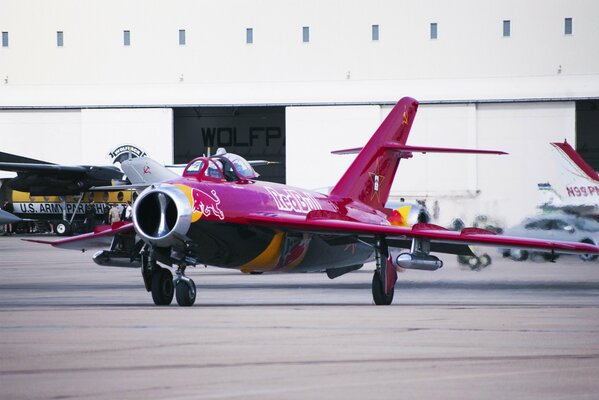 Mig-17 jet fighter in red bull coloring