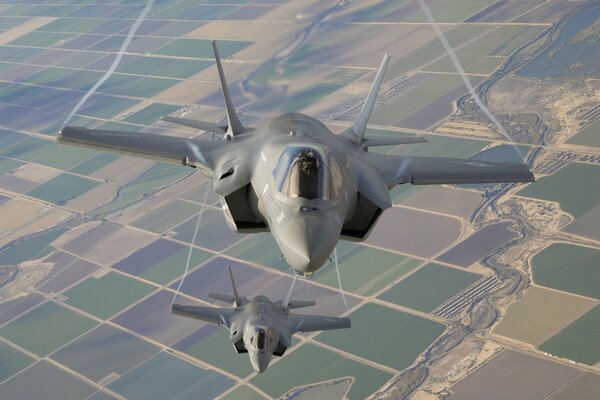 F-35b fighter-bombers in flight over the ground