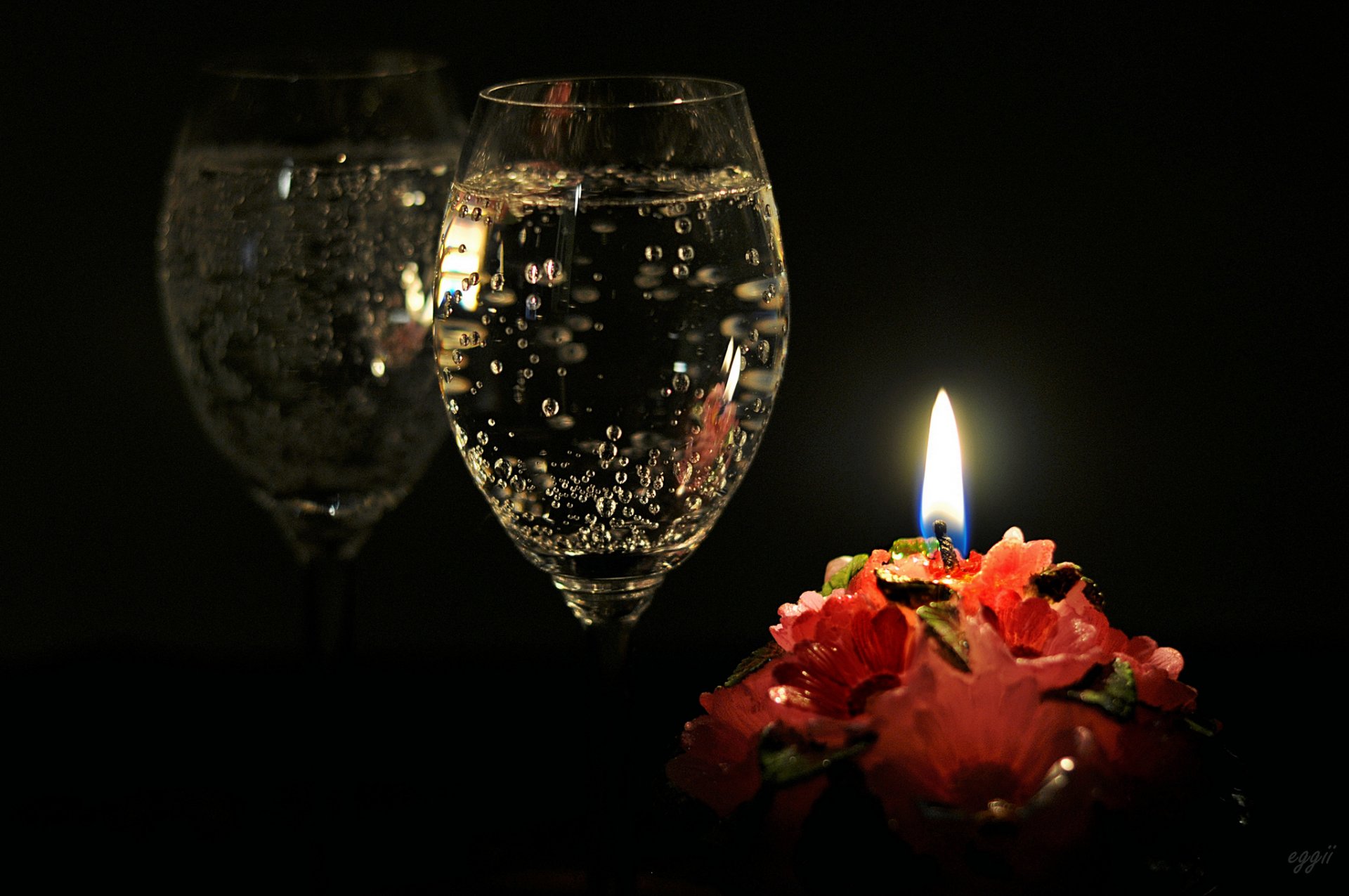 candle glass champagne reflection