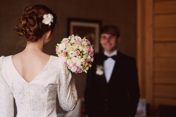 The groom meets the bride in the room