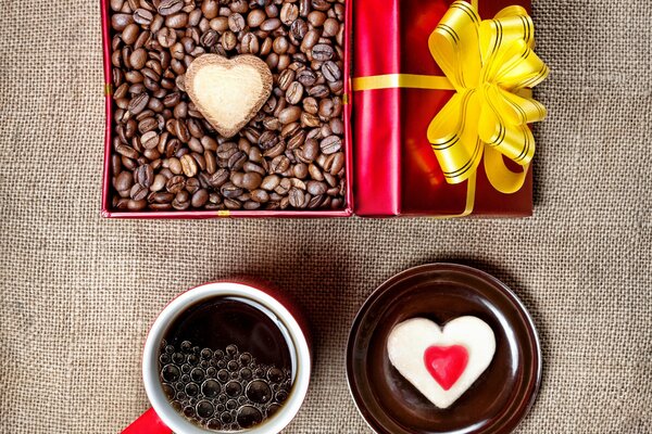 Black coffee and a gift box with beans