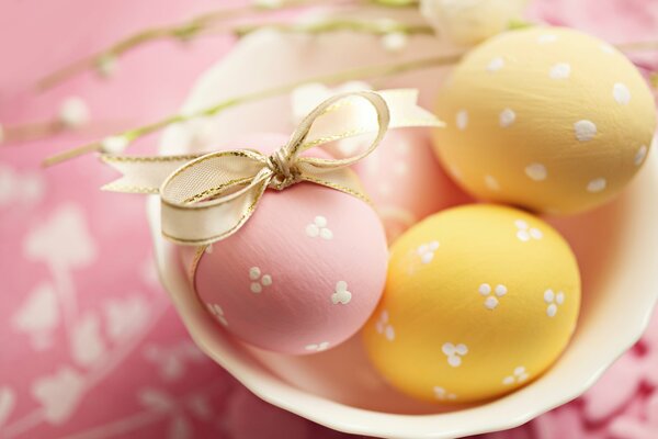 Beautiful multicolored eggs for a holiday in elegant ribbons