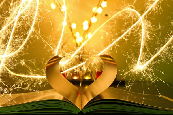 Holiday card heart-shaped book leaves and sparklers