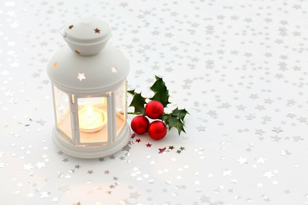 Flashlight with candles on a white background with stars