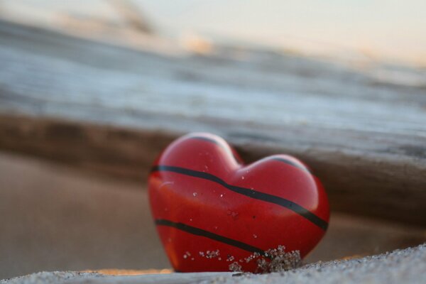 Drawing on a stone in the form of a heart