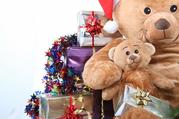 Teddy bears with gift boxes and tinsel