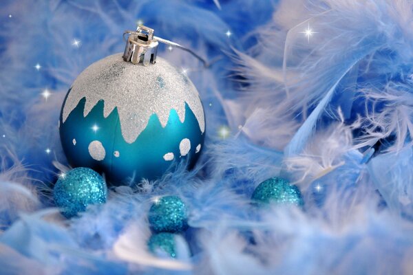 Christmas toy: blue ball on a blue background