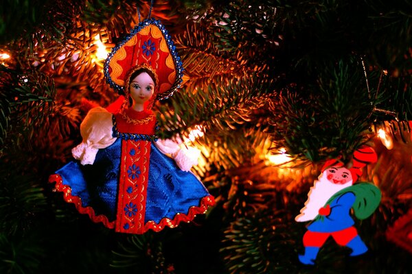 New Year and Christmas: a toy in a sundress and a cocoanut on the Christmas tree