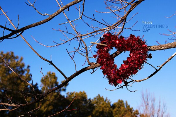 Heart of red flowers on a tree