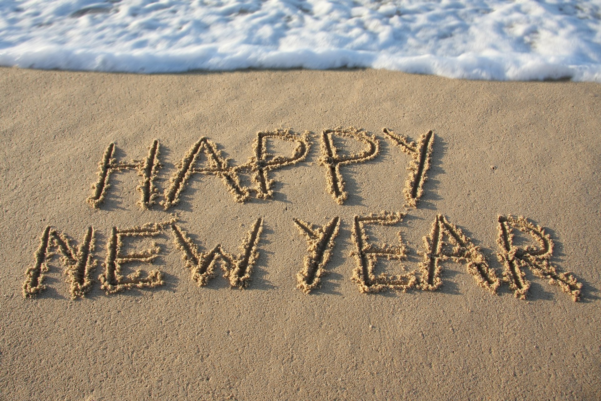 feliz año nuevo playa arena mar feliz año nuevo