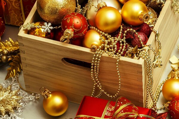 A box with beads and Christmas tree toys