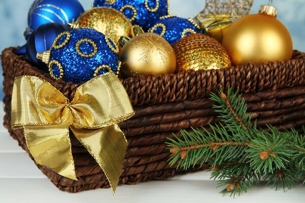 Gold and blue Christmas tree toys in a basket