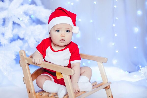 Photo d un enfant dans un bonnet de Noël