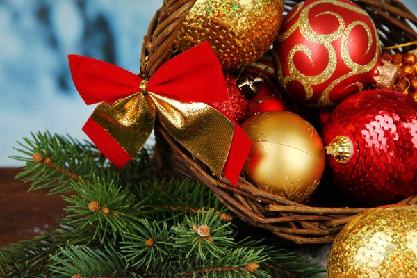 Red and gold Christmas tree toys in a basket