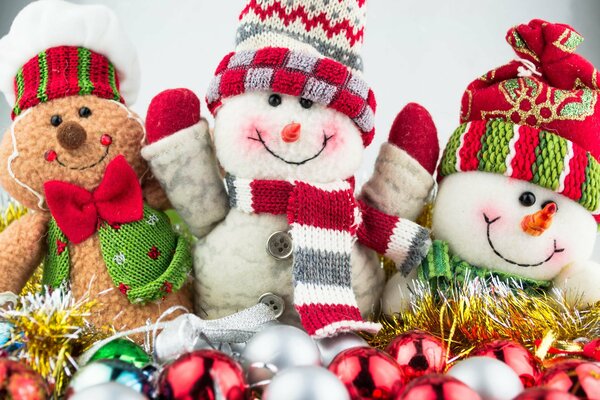 Christmas soft snowmen in beautiful outfits