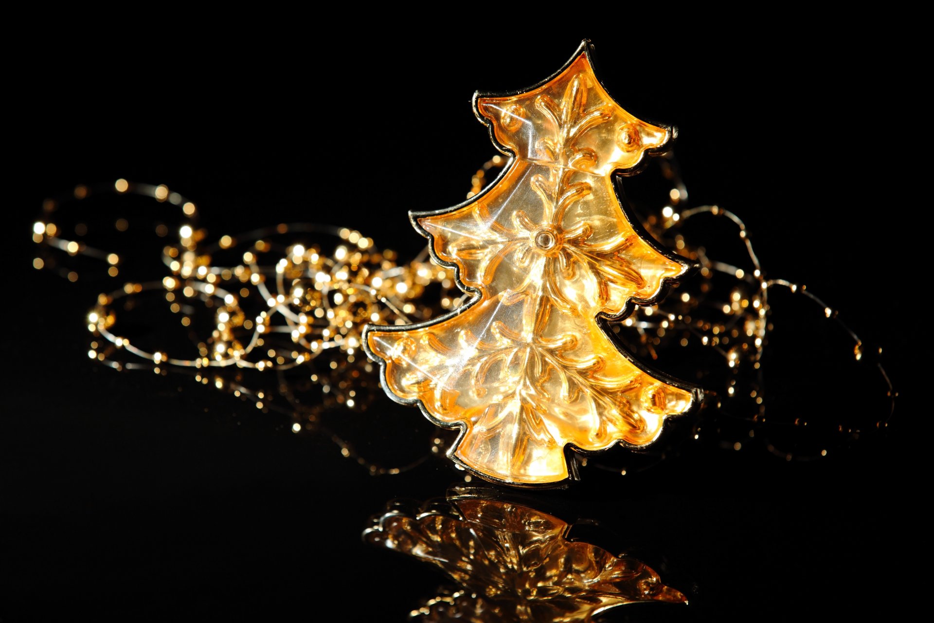 new year christmas winter holidays christmas tree toys gold background black reflection scenery