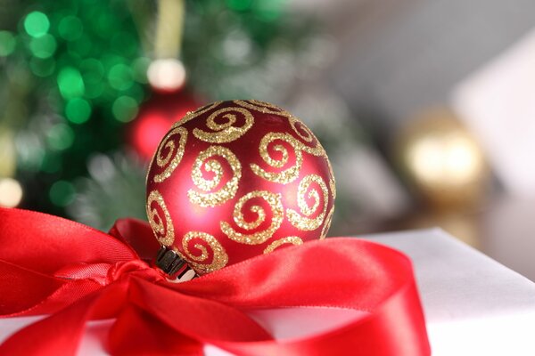 Red Christmas ball with ribbon