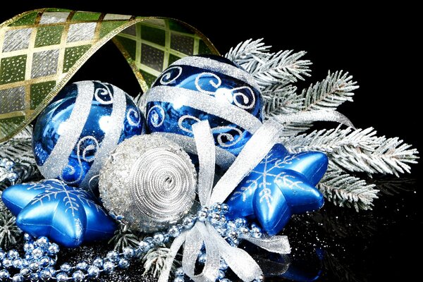 Blue Christmas tree balls and a silver spruce branch