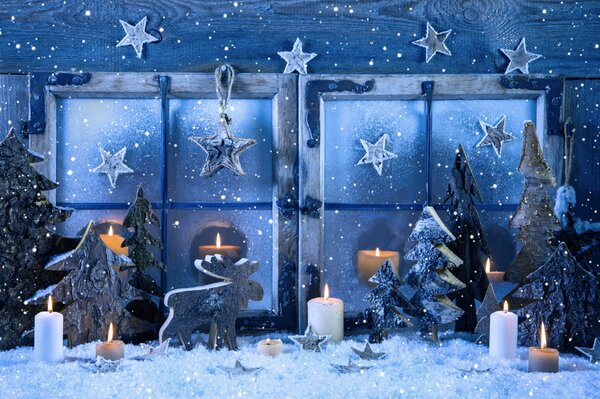 Christmas window with stars and candles