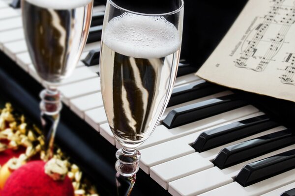 Champagne glass on the background of the piano