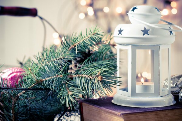 White Christmas flashlight with a spruce branch