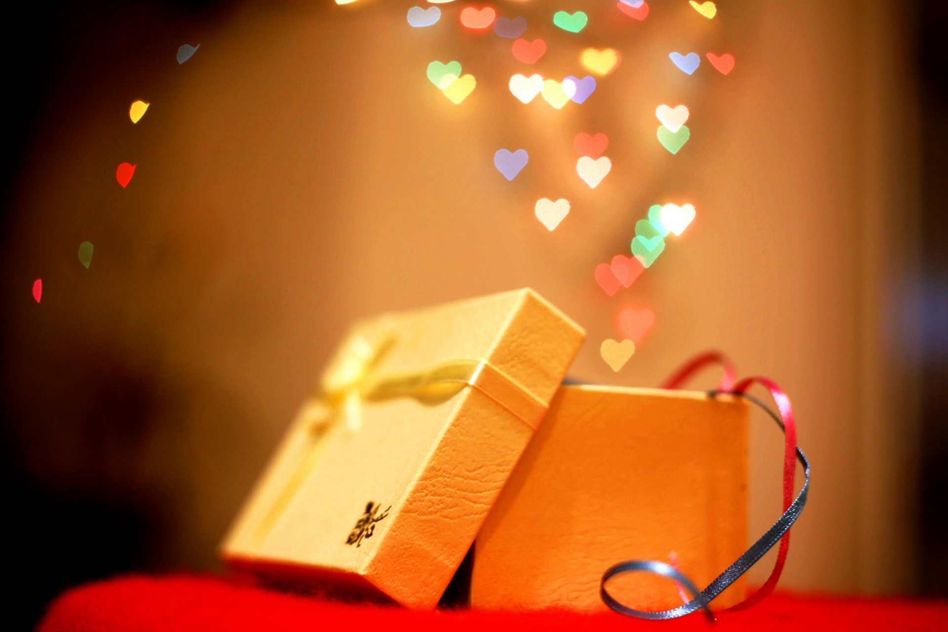 holiday new year christmas chrismas present box belt ribbon bokeh heart blur background wallpaper widescreen full screen hd wallpaper