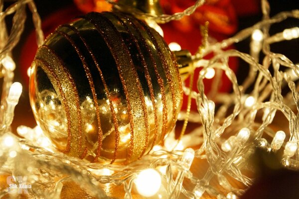 Christmas garland with a golden Christmas ball