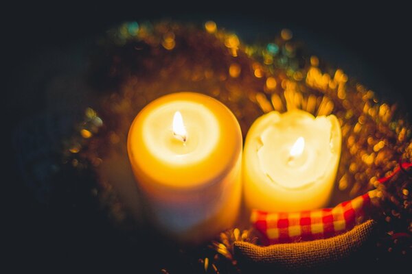 Two candles on a dark background for the new year