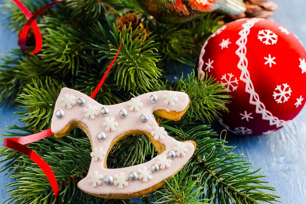 Festive cookies in the form of a toy horse in glaze