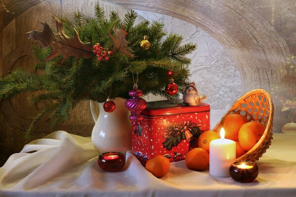 Christmas tree with tangerines and a candle