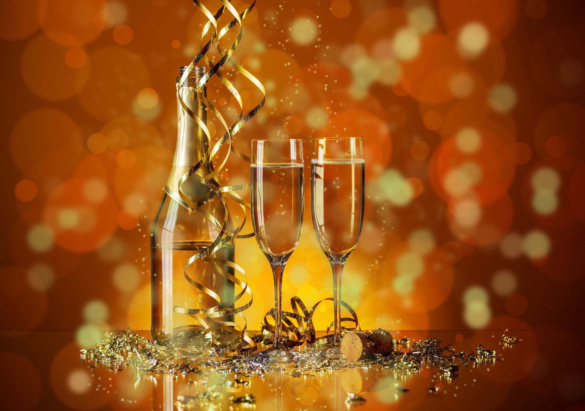 holiday new year glasses a bottle plug champagne serpentine bokeh