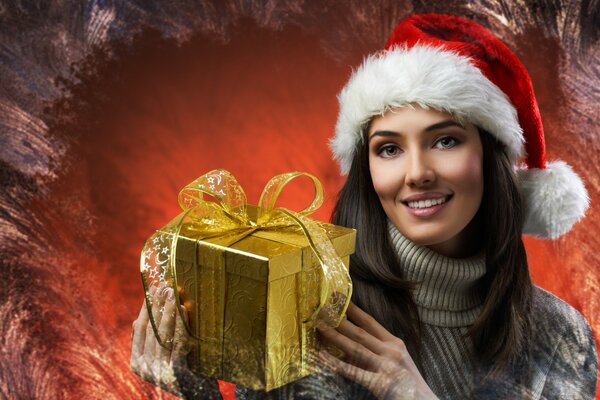 New Year s picture of a brown-eyed girl in a sweater with a gift box on the background of a frosty pattern