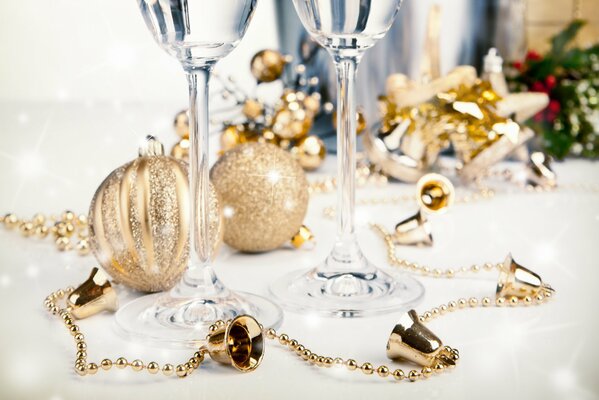 Champagne glasses with Christmas decorations on the table