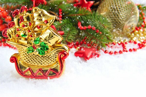 Golden Christmas tree toy in the form of a sleigh