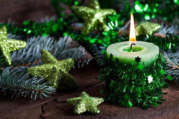 Candle and Christmas stars for table decoration