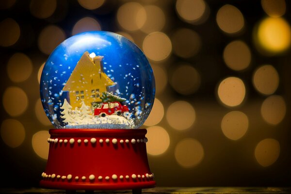 Boule de verre de jouet de Noël avec de la neige à l intérieur