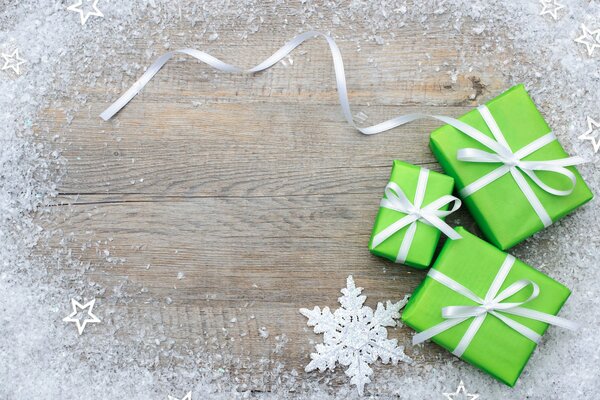 Snowflake on a tree surrounded by boxes