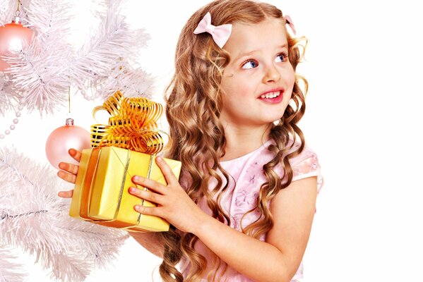 New Year s card with a girl with beautiful curls and a gift in her hands