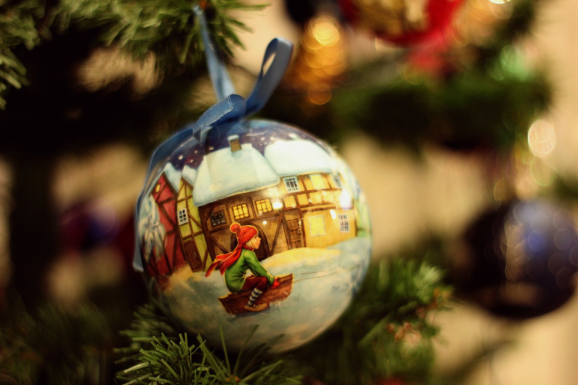 christmas tree toys close up bokeh child on a sled