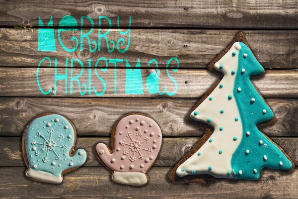 Gingerbread with icing, mittens and a Christmas tree Santa Claus delivers gifts