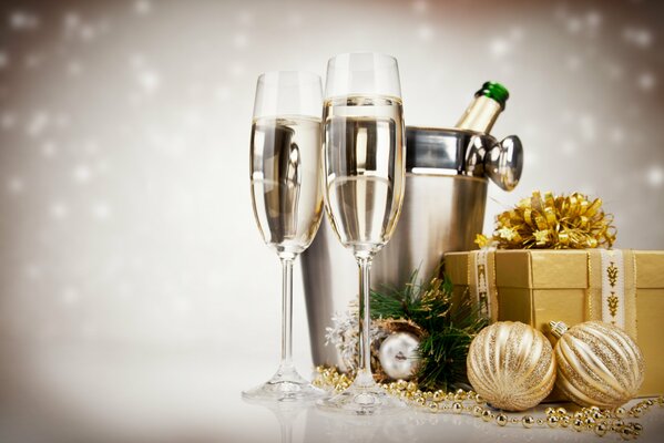 Festive glasses, champagne, gifts