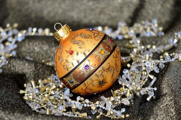 A golden ball adorns the fabric