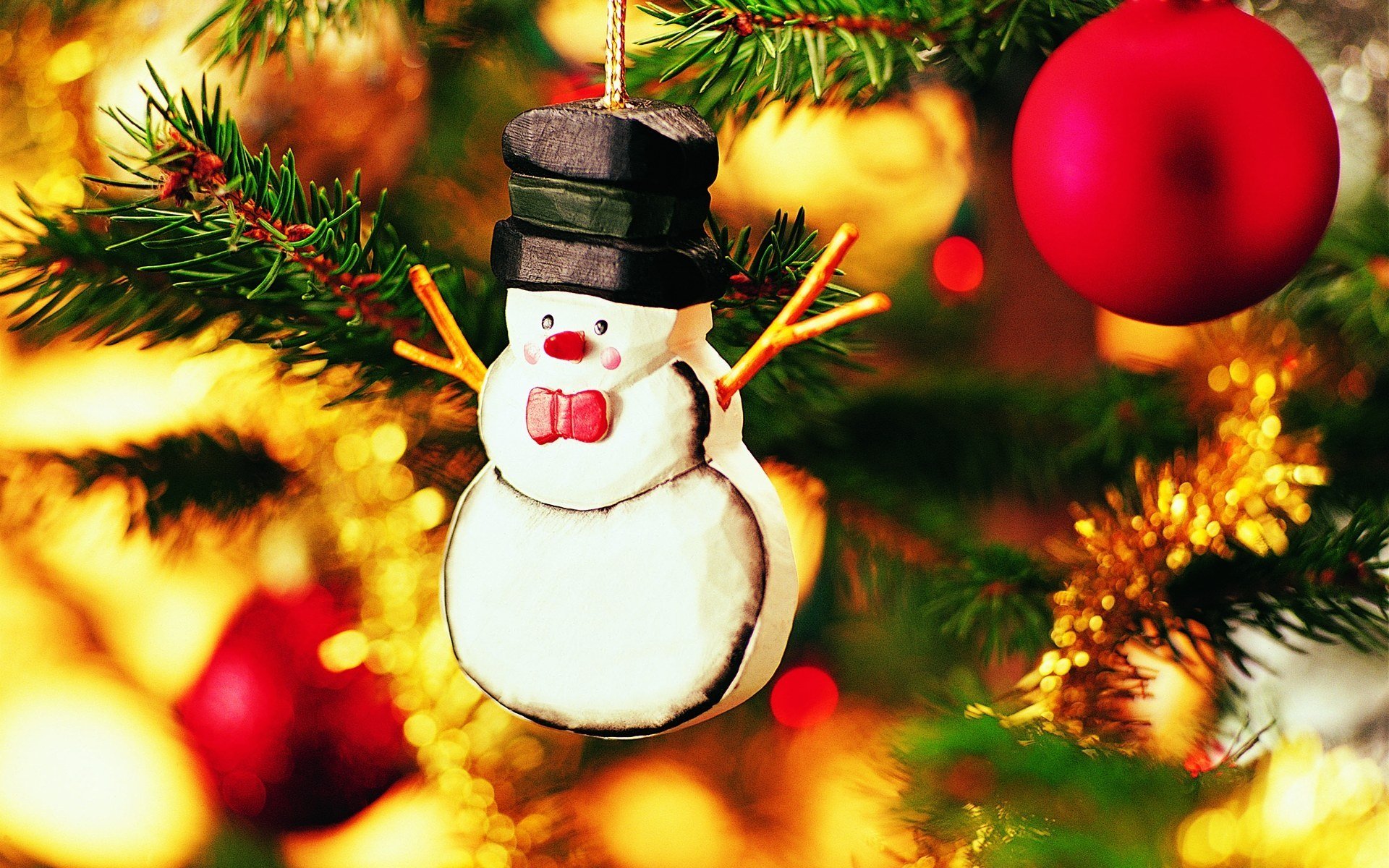 new year snowman toy on the christmas tree christmas background