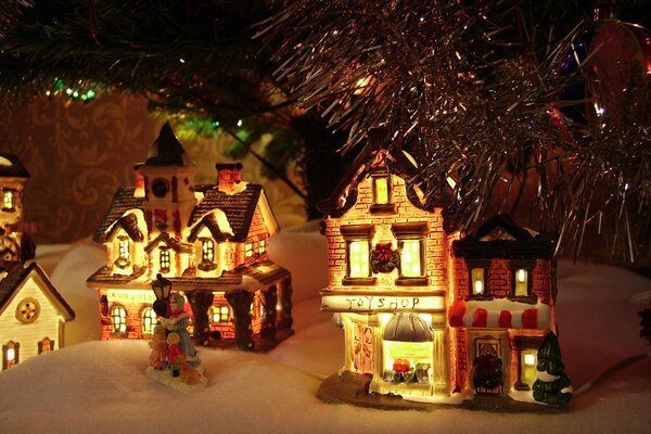 Dekoracje świąteczne domki pod choinką 