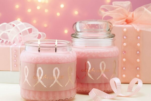 Pink candles in glass jars