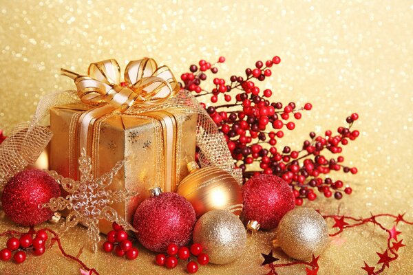 Golden gift box among Christmas balls